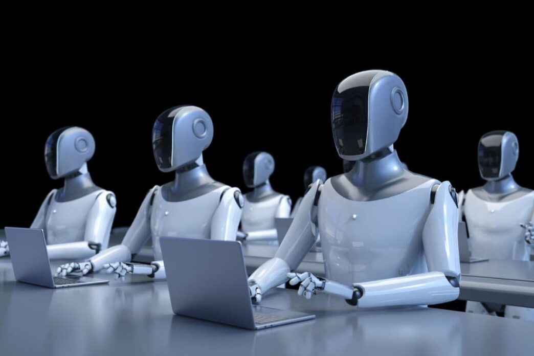 фото: роботи за ноутбуками – ризики штучного інтелекту