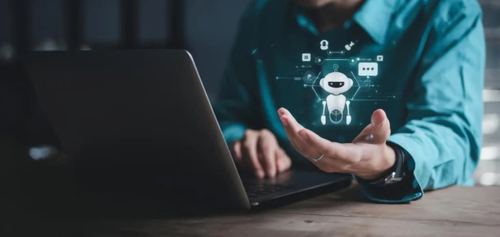фото: людина працює за ноутбуком із технологіями штучного інтелекту